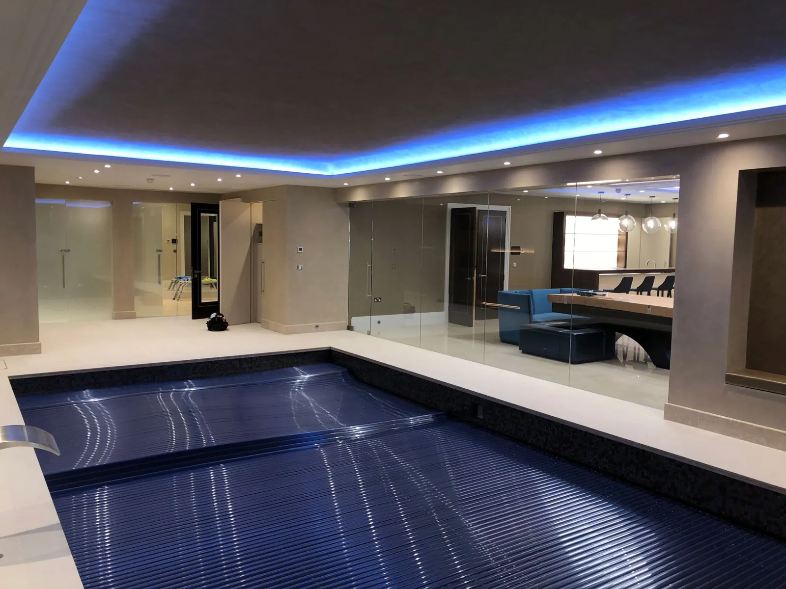 Indoor pool with frameless glass partitions