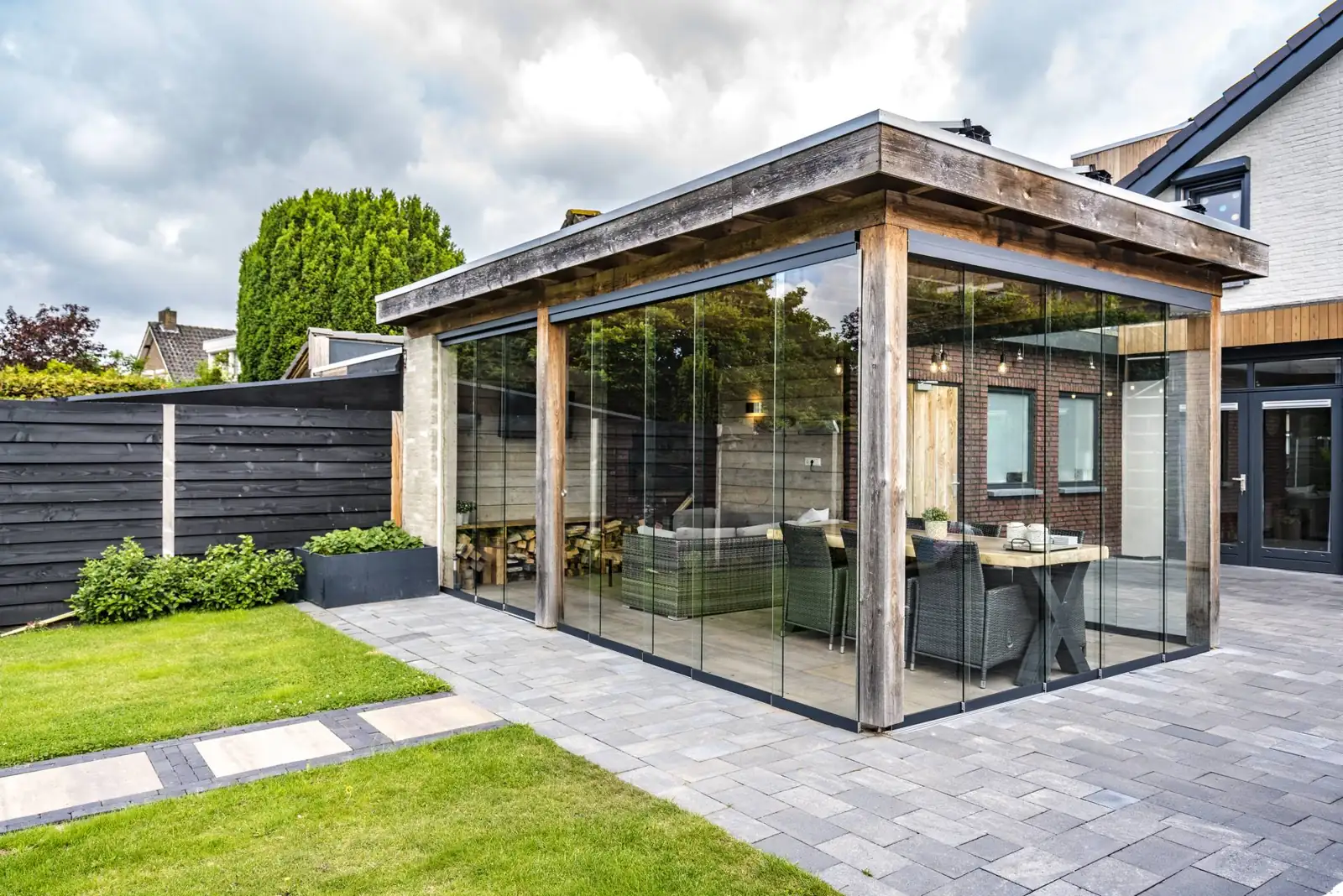 Deponti glass veranda over a garden terrace