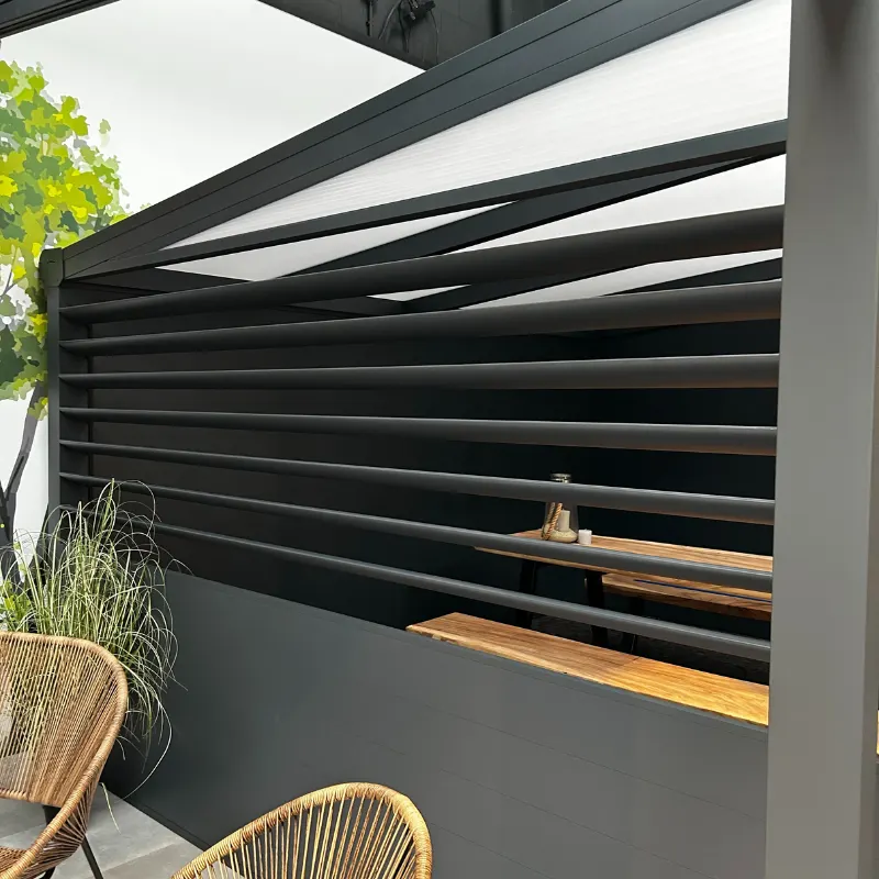 Deponti Louvres black slatted side wall under a veranda with a timber bar shelf