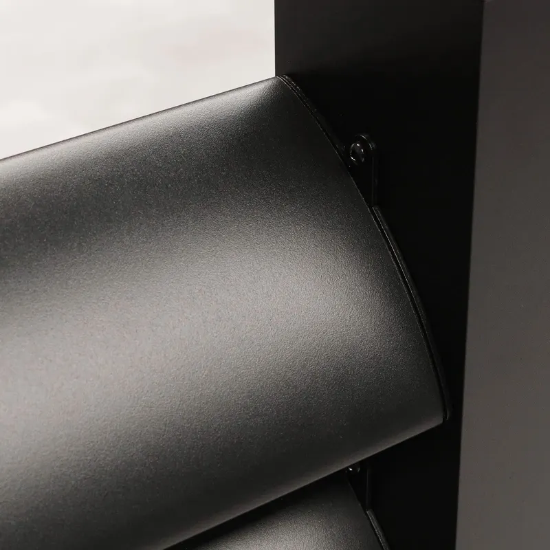 Close up of a Deponti Louvres oval black slat meeting its aluminium mounting post