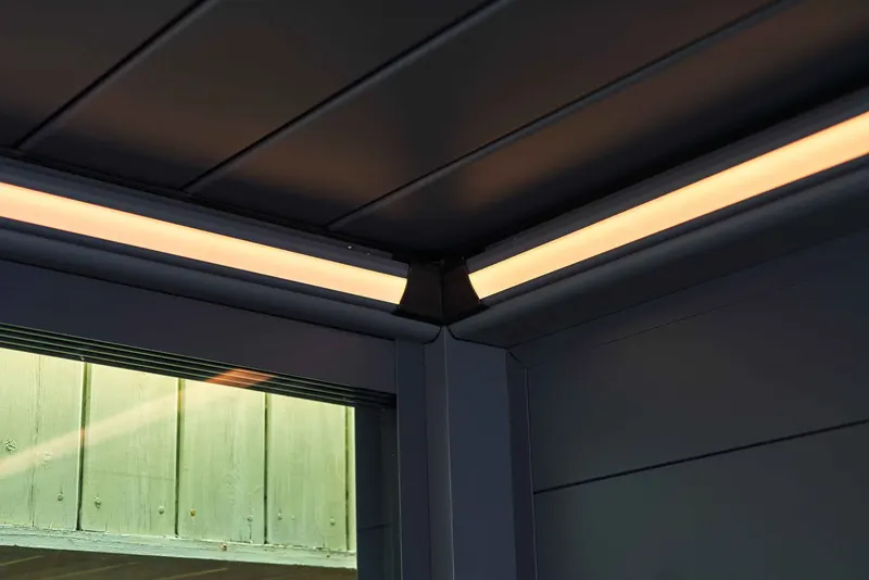 Close view of warm LED strip lighting along the frame of a Deponti Pinela pergola