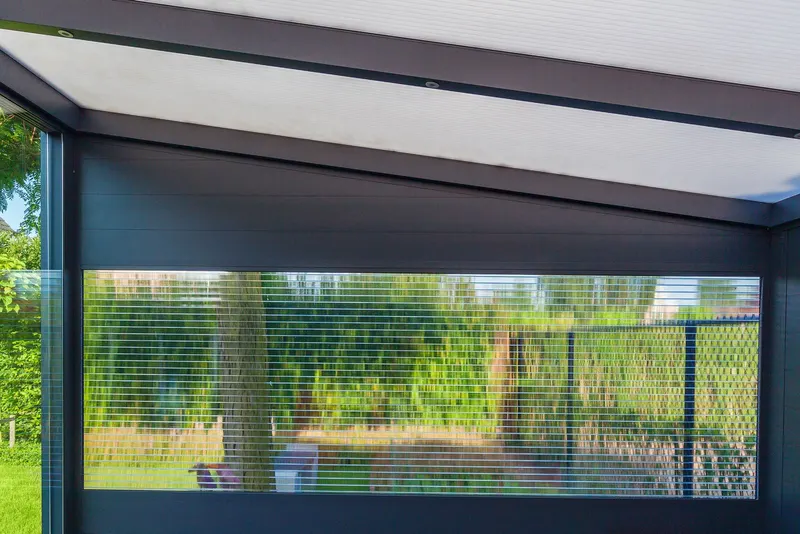 Deponti Ribolla frame with a clear panel looking out onto a green garden