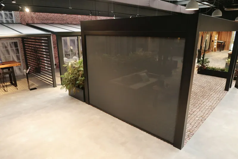 Elevated view of a Deponti Screen closed on one side of a dark pergola