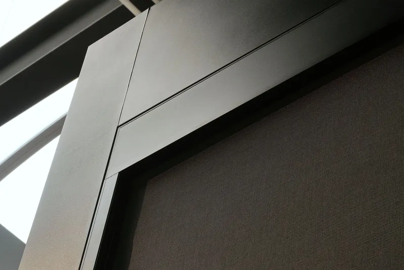 Close up of a Deponti Screen cassette corner and dark mesh fabric on a black frame
